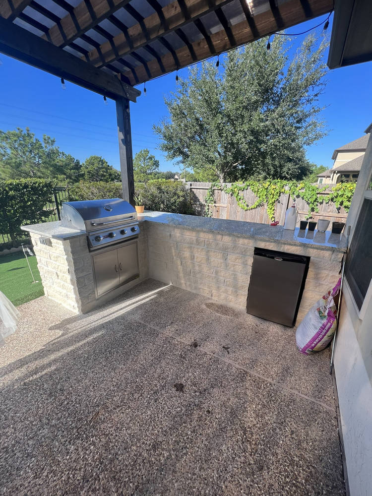 Custom pergola and patio cover built over pool in Houston backyard