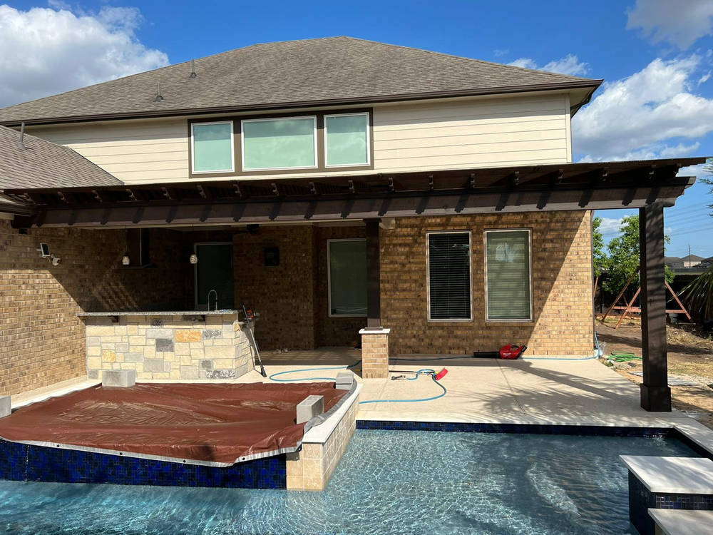 Solid roof patio cover attached to Houston home